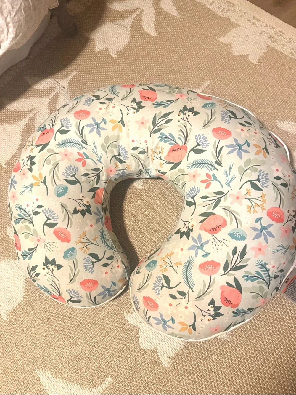 Boppy Floral Nursing Pillow in Cream with Coral, Teal, and Green Accents